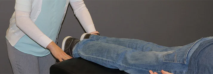 Chiropractor Waukee IA Kelsey Pettitt Our Activator Chiropractic Method Dr. Kelsey Pettitt performing their activator chiropractic method.