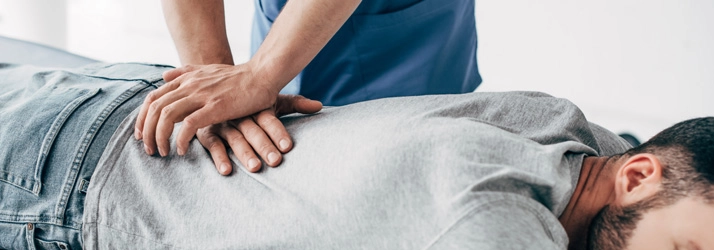 Chiropractic Waukee IA Chiropractic Adjustment A patient receiving a back adjustment.